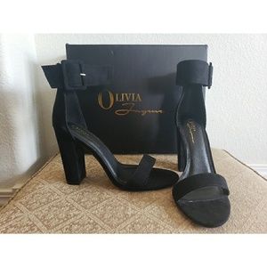 Black heels with wrap around ankle buckle